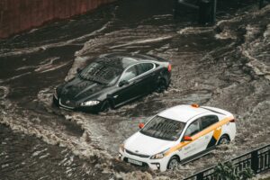 flooded roads, dangerous roadway, flooded cars