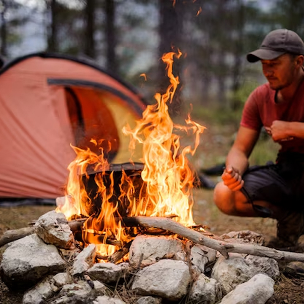 building a fire at camp